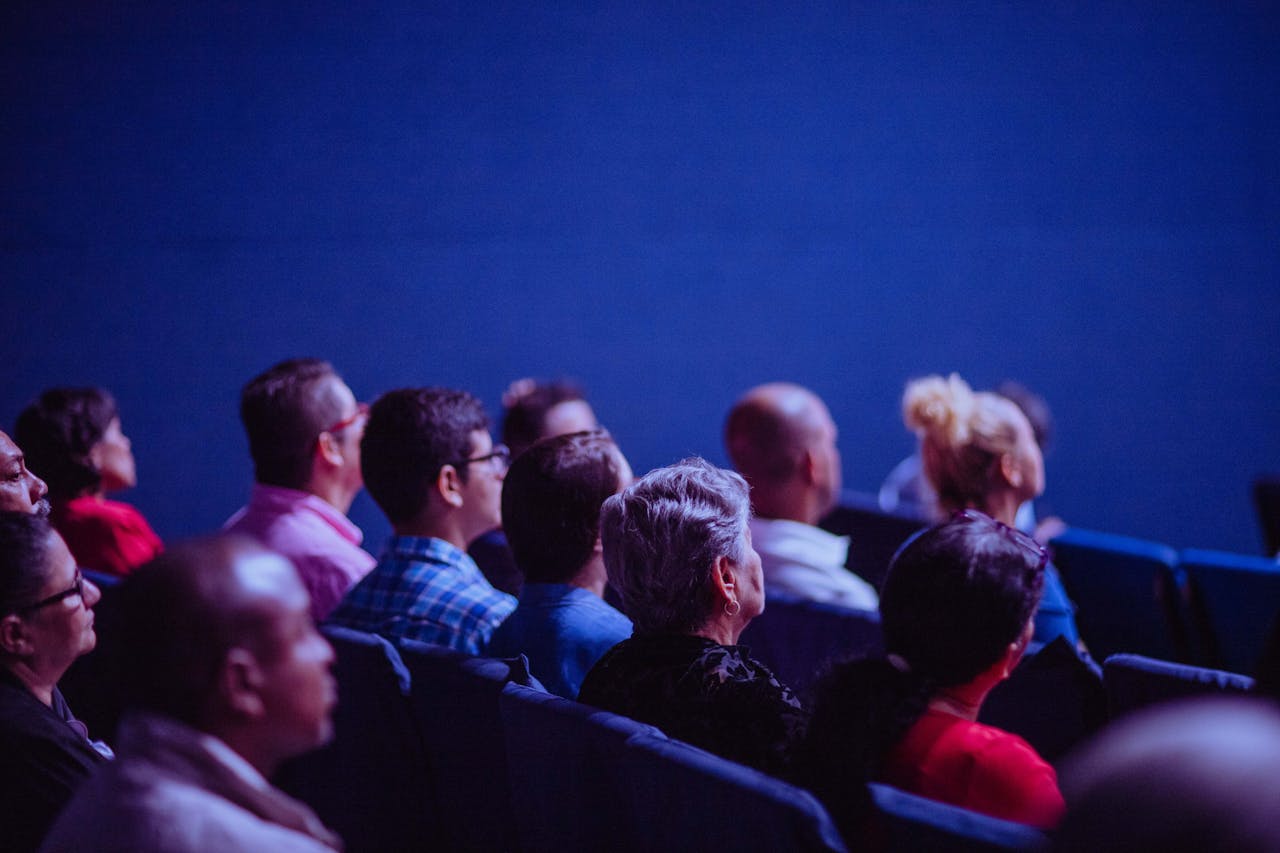 Viewers of the media event in the auditorium